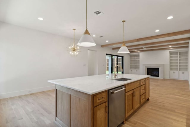 kitchen with an island with sink, dishwasher, beamed ceiling, light wood-type flooring, and sink