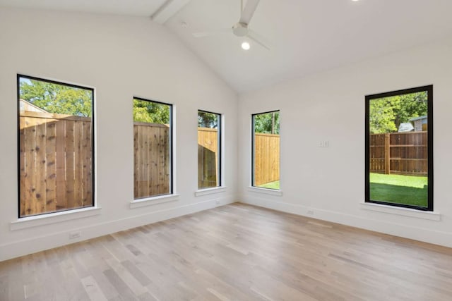 spare room with light hardwood / wood-style floors, beam ceiling, ceiling fan, and high vaulted ceiling