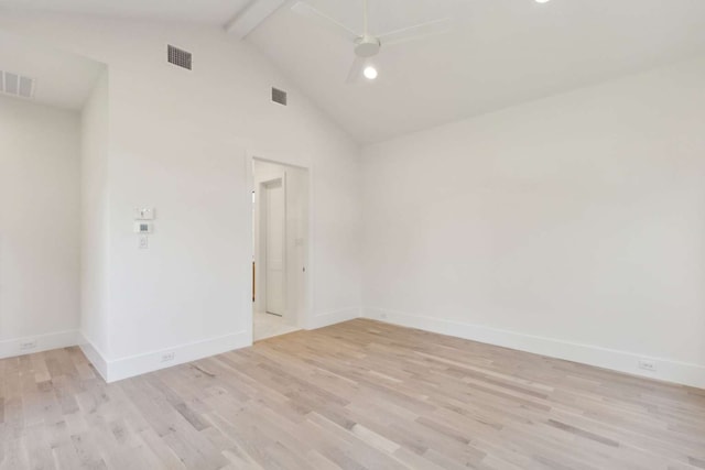 spare room with ceiling fan, beamed ceiling, light wood-type flooring, and high vaulted ceiling