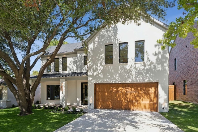 view of front facade with a front yard and a garage