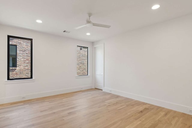 unfurnished room with ceiling fan and light hardwood / wood-style flooring