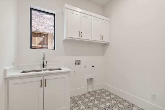 clothes washing area featuring hookup for a washing machine, cabinets, sink, and electric dryer hookup