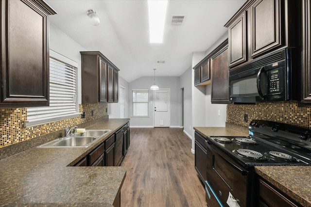 kitchen with black appliances, dark wood-type flooring, sink, dark brown cabinets, and decorative light fixtures