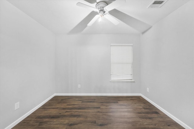 empty room featuring ceiling fan and dark hardwood / wood-style floors