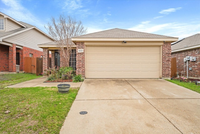 ranch-style house featuring a front lawn and a garage