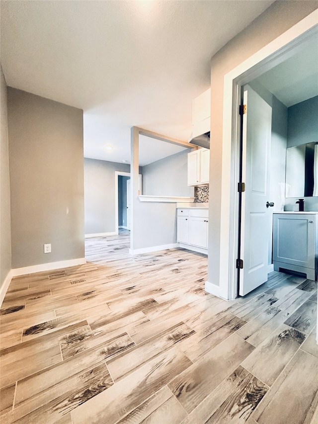 unfurnished living room featuring light hardwood / wood-style floors