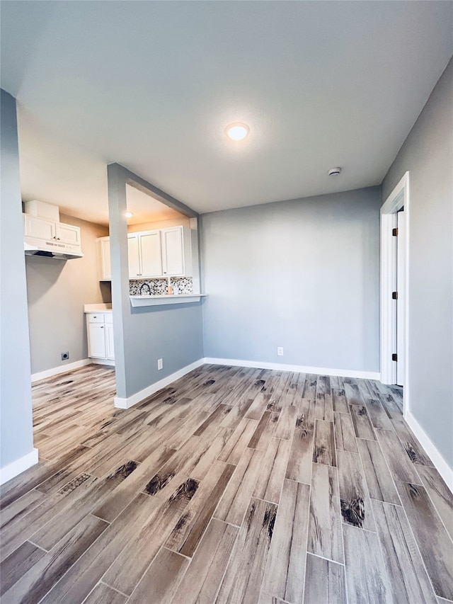 unfurnished living room with light hardwood / wood-style floors