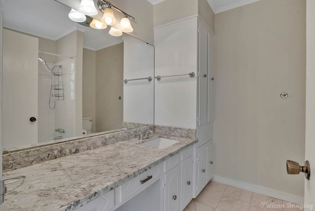 bathroom featuring crown molding, tiled shower, vanity, and toilet