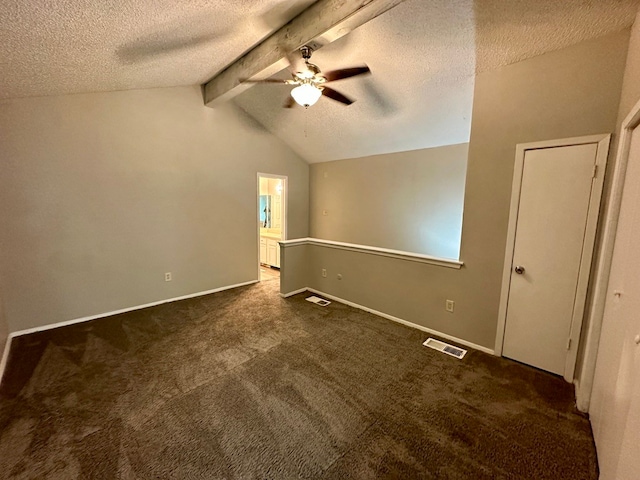 unfurnished bedroom featuring lofted ceiling with beams, carpet, ceiling fan, and a textured ceiling