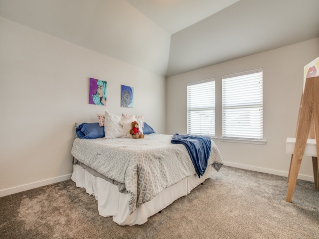 bedroom with carpet and vaulted ceiling