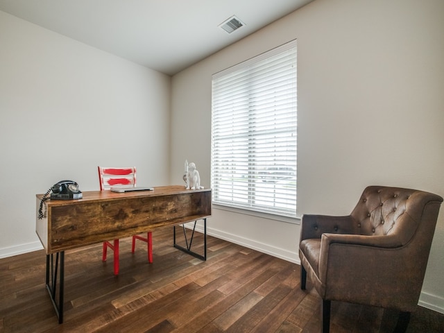 office space with dark wood-type flooring