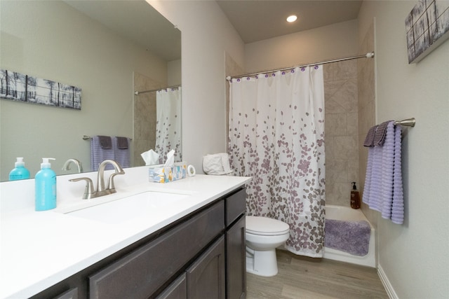 full bathroom featuring hardwood / wood-style flooring, vanity, toilet, and shower / bath combination with curtain