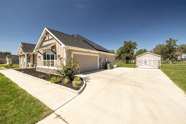 view of front of property with a garage and a front lawn