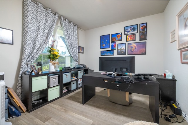 office area with hardwood / wood-style flooring