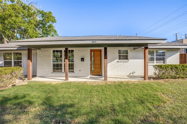 view of front of home with a front lawn