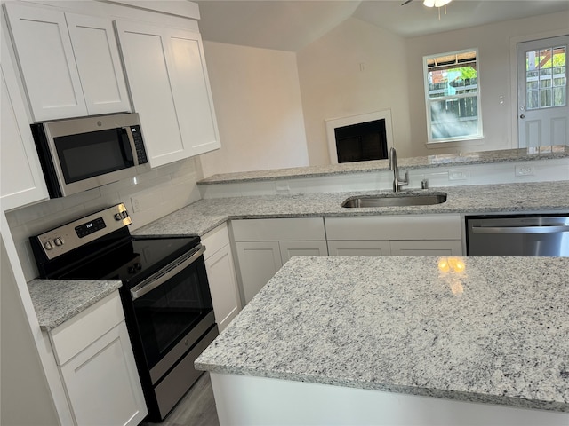 kitchen featuring white cabinetry and appliances with stainless steel finishes