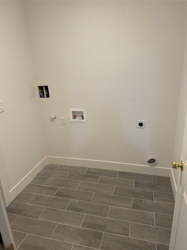 clothes washing area featuring gas dryer hookup, hookup for an electric dryer, and washer hookup