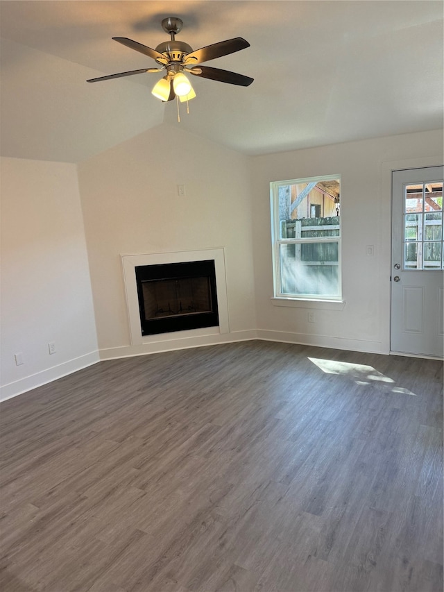 unfurnished living room with vaulted ceiling, dark wood-type flooring, and ceiling fan