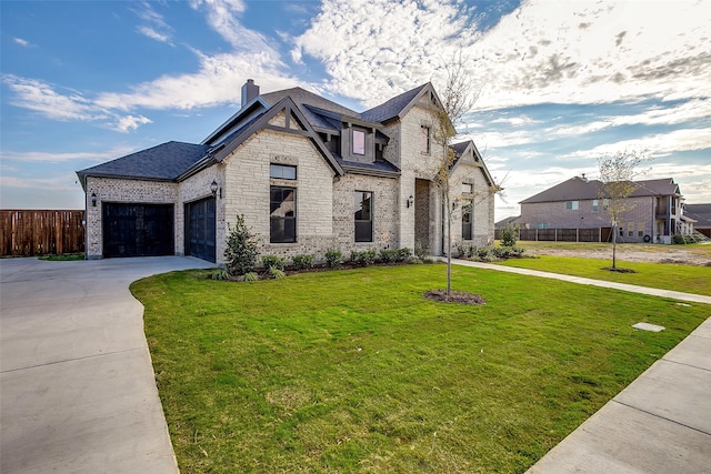 view of front facade featuring a front yard and a garage