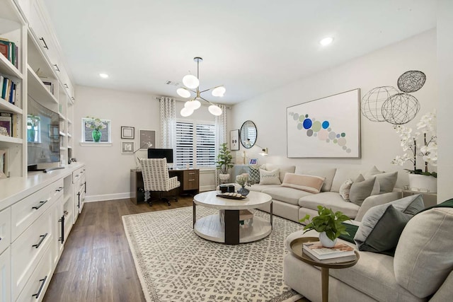 living room featuring dark hardwood / wood-style flooring and a notable chandelier