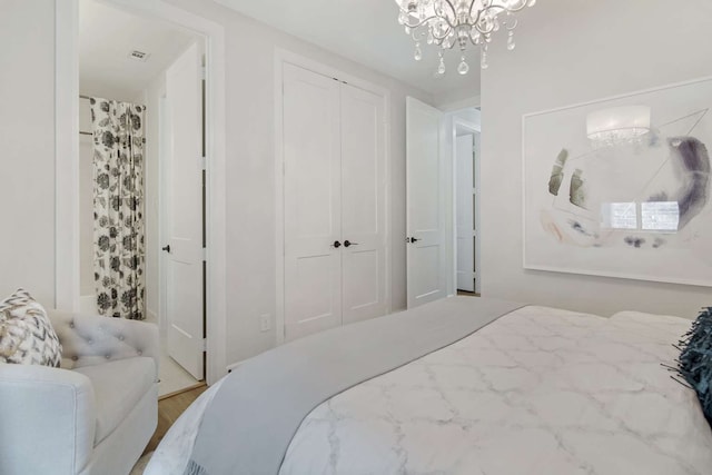 bedroom with a notable chandelier