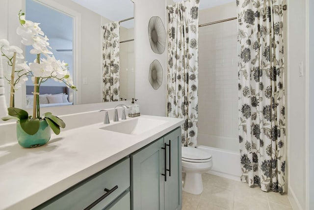 full bathroom featuring vanity, shower / tub combo with curtain, tile patterned floors, and toilet