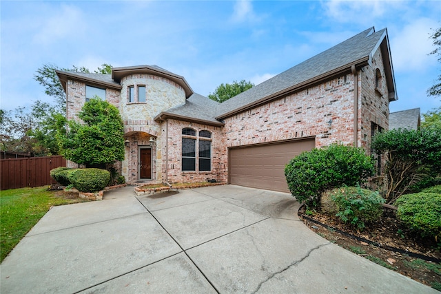 french provincial home featuring a garage