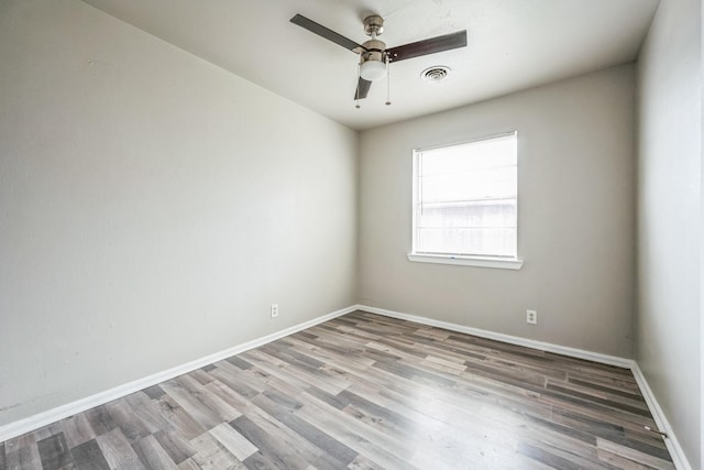 unfurnished room with wood-type flooring and ceiling fan