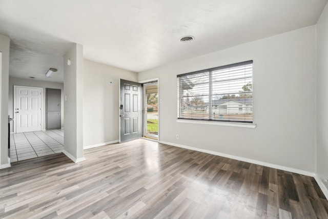 empty room with wood-type flooring