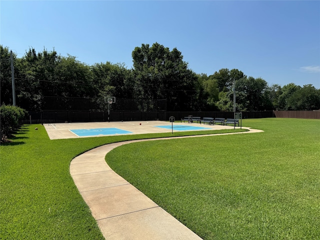 view of community featuring a yard and a pool