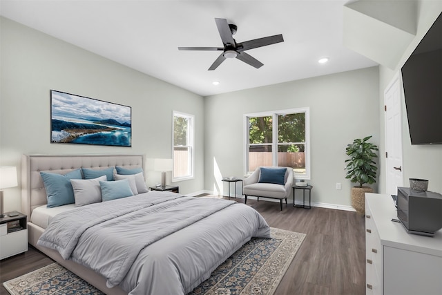 bedroom featuring ceiling fan and dark hardwood / wood-style floors