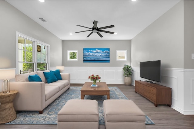 living room with ceiling fan and hardwood / wood-style floors