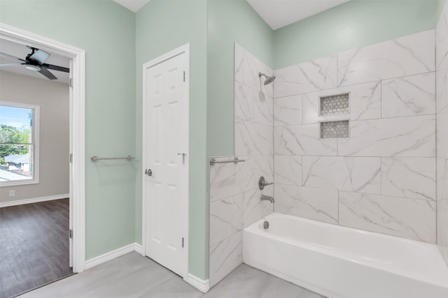 bathroom with ceiling fan, tile patterned flooring, and tiled shower / bath