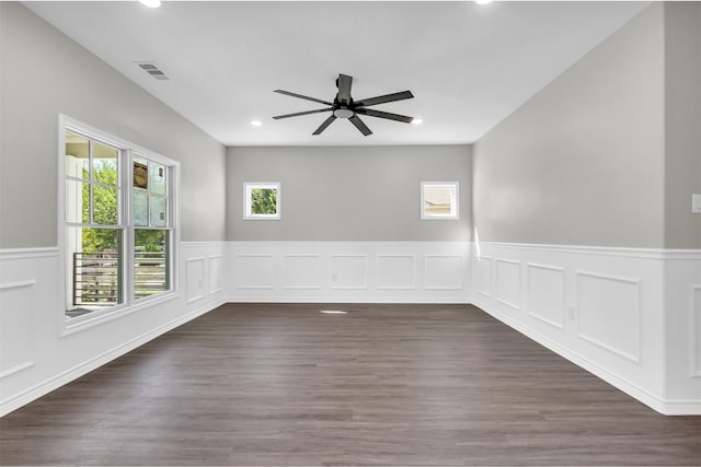 unfurnished room featuring ceiling fan and dark hardwood / wood-style flooring