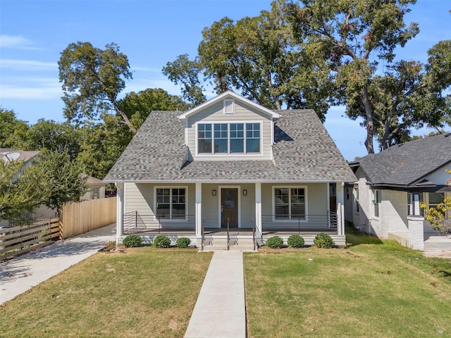 bungalow-style house with covered porch and a front yard