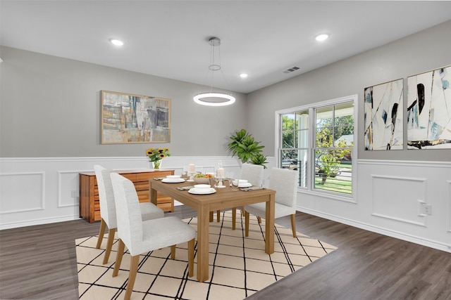 dining space featuring hardwood / wood-style flooring