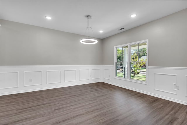 empty room with dark hardwood / wood-style floors