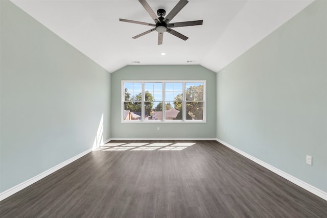 unfurnished room featuring ceiling fan, dark wood-type flooring, and lofted ceiling