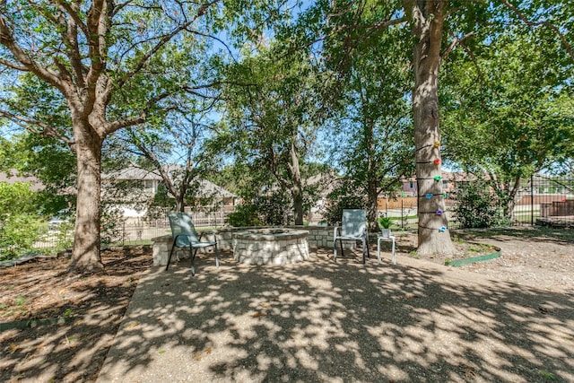 view of yard featuring a patio and a fire pit