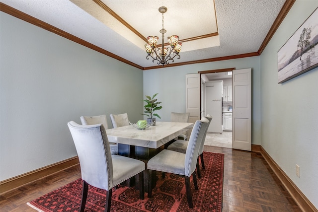 dining area featuring a textured ceiling, ornamental molding, a chandelier, and dark parquet flooring