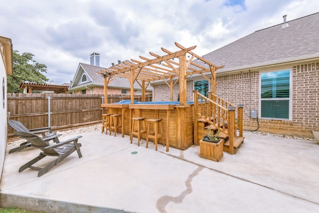 view of patio / terrace with a pergola and a bar