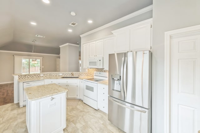 kitchen with sink, white cabinetry, kitchen peninsula, a kitchen island, and white appliances