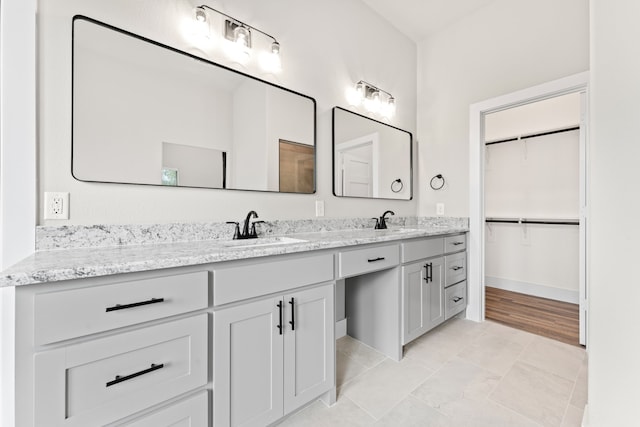 bathroom with hardwood / wood-style floors and vanity