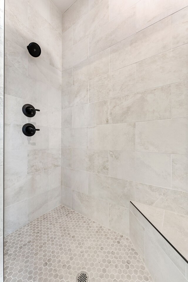 bathroom with a tile shower