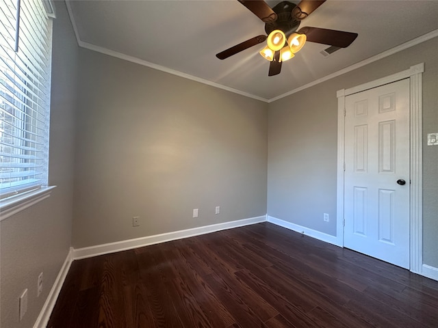 unfurnished bedroom featuring ornamental molding, dark hardwood / wood-style flooring, and ceiling fan