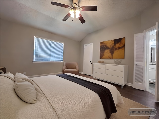 bedroom featuring ceiling fan, a textured ceiling, vaulted ceiling, and dark hardwood / wood-style flooring