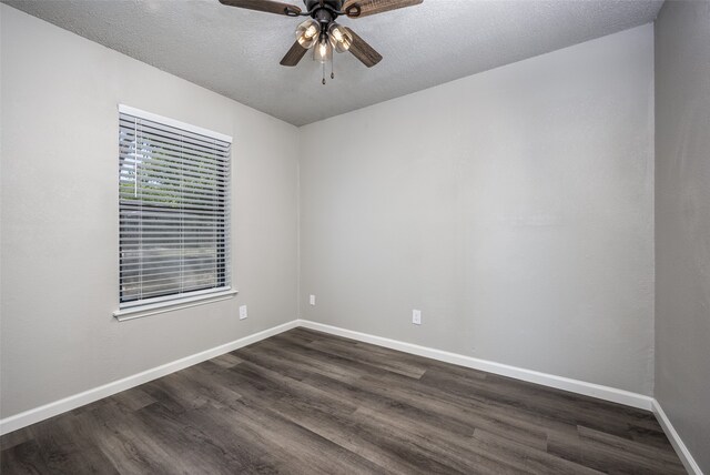 empty room featuring baseboards, a textured ceiling, ceiling fan, and dark wood-style flooring