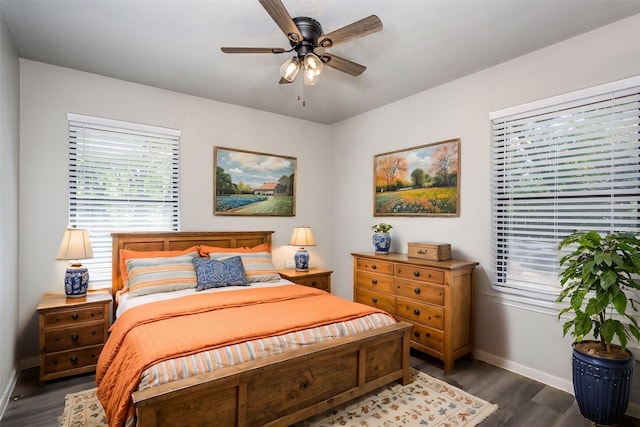 bedroom featuring dark wood-style floors, baseboards, and ceiling fan