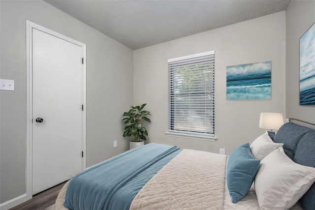 bedroom with wood finished floors