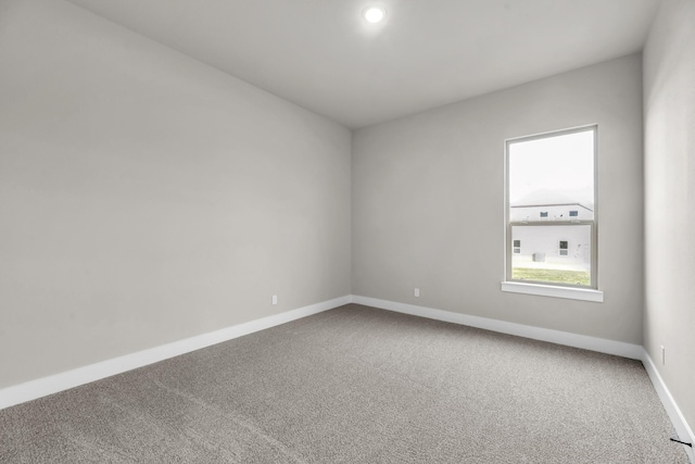 unfurnished room featuring carpet floors